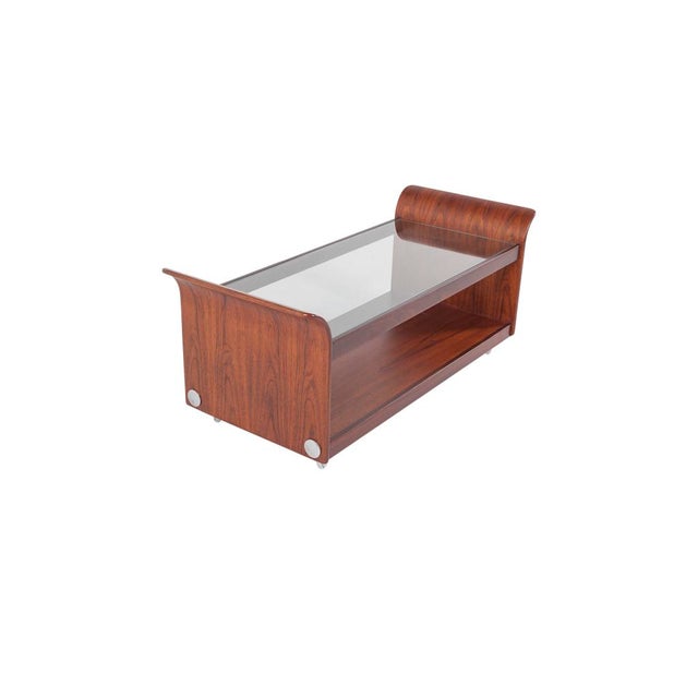 A stylish 1970s teak and glass 'tulip' coffee table by g plan, uk. It is a great size with large base shelf under the...