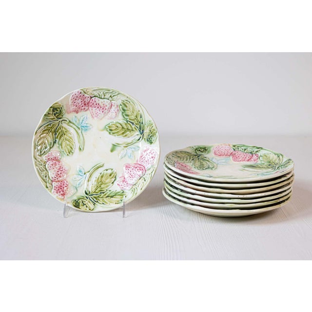 A set of French Majolica strawberry plates from the 19th century, with pink, green and blue accents, priced and sold...