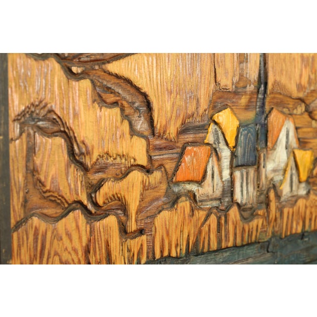Original carved and painted wood panel by Jean-Claude Gaugy depicting a coastal town. All pieces from the collection we...