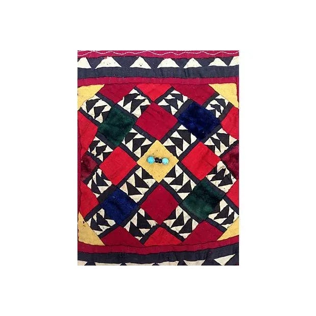 Embroidered fragment of a vintage, cotton textile with fringe and beads. From the Grand Bazaar in Istanbul.