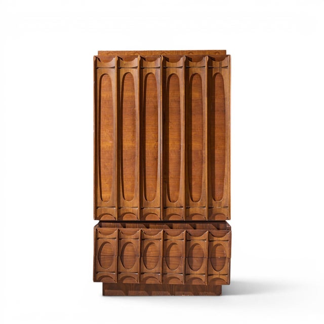 Tobago Brutalist Mid Century Walnut Armoire Dresser This armoire measures: 40 wide x 21.5 deep x 72.5 inches high Fair...