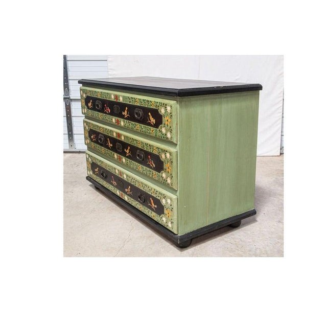 This is a hand paint-decorated pine bird chest, originally from Wisteria. It is a three-drawer commode or chest, painted...