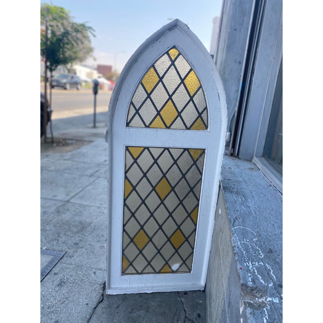 This is one of four windows salvaged out of an old church in Los Angeles. This window has such charm to it, I absolutely...