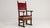 A Renaissance-style throne chair featuring a high back and carved wooden structure. The design emphasizes verticality and...