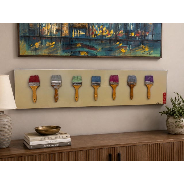 Such a fun piece by artist Andy Anh Ha, combining painting and sculpture in one. A series of actual wooden-handled...