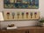 Such a fun piece by artist Andy Anh Ha, combining painting and sculpture in one. A series of actual wooden-handled...