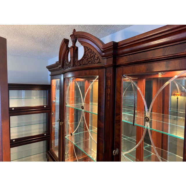 An impressive china cabinet and breakfront from Broyhill Furniture Industries’ 100th Anniversary Collection, created to...