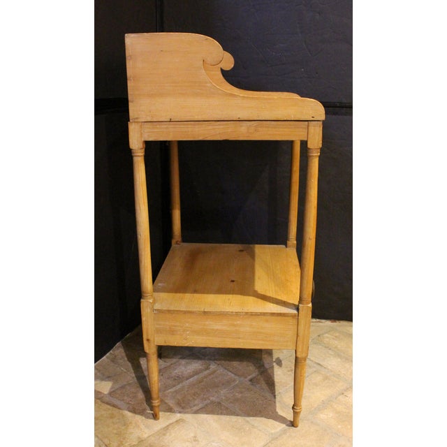 Circa 1810-20 English Regency period pine washstand table. Once painted. The galleried solid top makes it excellent for a...