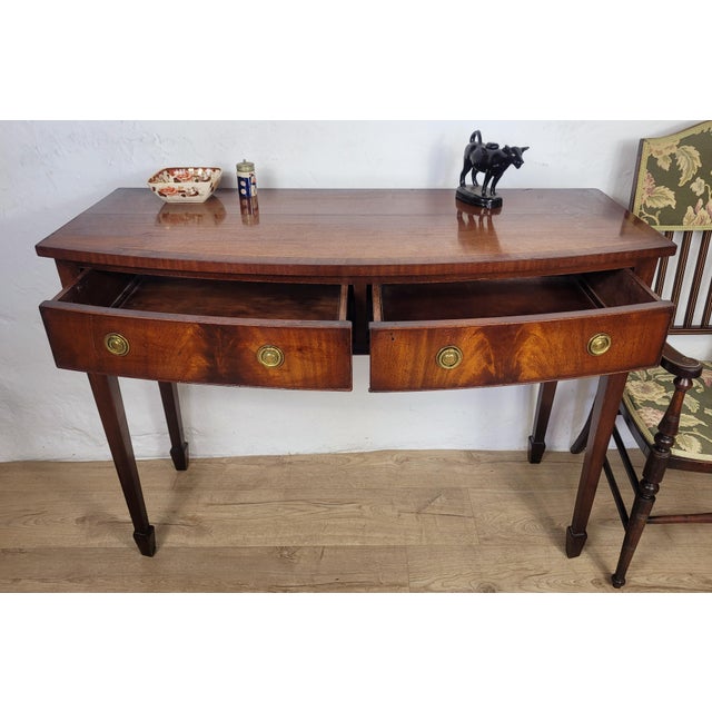 This is a wonderful example of a Reproduction 'G.T. Rachstraw' Georgian Style Side Table, that is sure to impress in a...