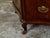 An Italian walnut commode from the early 19th century, with three drawers, serpentine front and bronze hardware. Created...