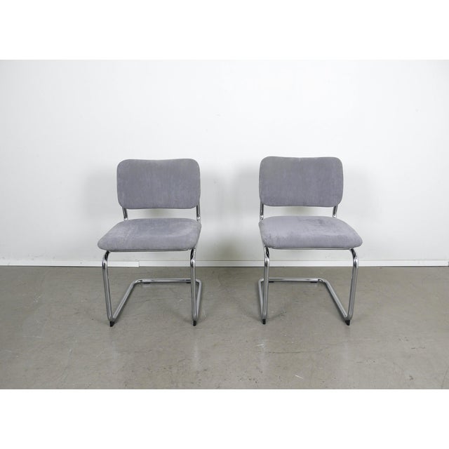 Set of two cantilever chairs with chrome-plated tubular steel frames and gray fabric upholstery from the 1970s. The...