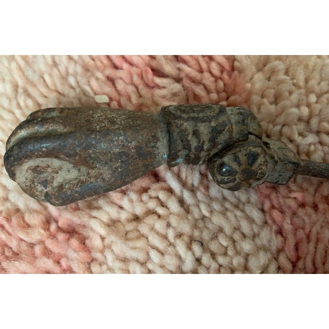 Antique French wrought iron door knocker, in the style of a hand with a ring holding a ball. I have 4 total, if you need...