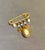 1960s-70s gold tone/faux pearl dangly safety pin locket brooch. Excellent condition.