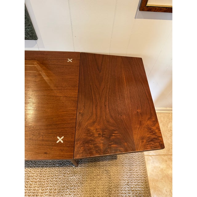 A mid century modern “Accord” drop leaf desk by American of Martinsville, circa 1960s. Gorgeous walnut woodgrain is paired...