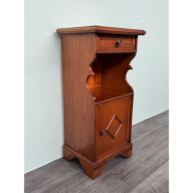 Italian wooden bedside table made in the 1970s. This vintage piece can also be used as an entryway piece or in a corner or...