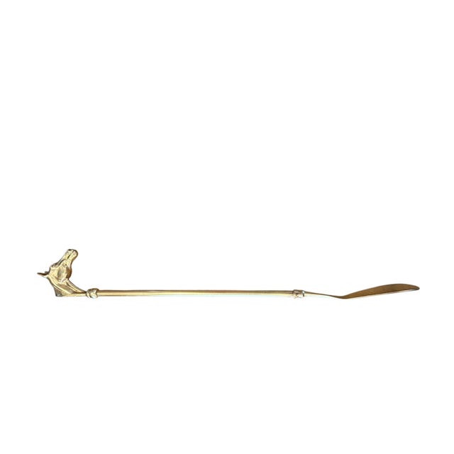 A charming, equestrian style shoe horn. Features a horse head finial with a long shaft and scoop shaped shoehorn. Solid...