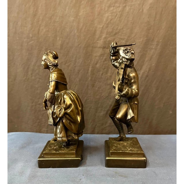This vintage mid 19th century pair of patinated continental bronze statues depict rural French country life. Each one is...