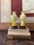 A striking pair of mid-century Chinese Peking glass vases featuring vibrant yellow overlay decoration carved against an...