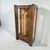 This Art Deco display cabinet is a vintage oak glass cabinet designed to elevate your home with timeless style and...