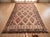 This oversized vintage kilim, believed to date from the 1990s, is handwoven in a traditional flatweave construction. An...