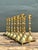 Elevate your tablescape with this striking collection of twelve vintage brass candlesticks. Characterized by their elegant...