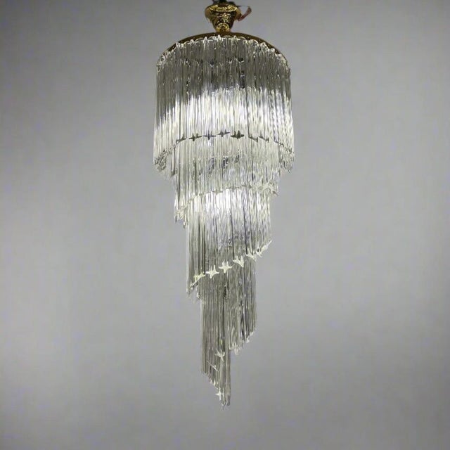 A fine Italian Art Glass chandelier by Venini circa 1950. The circular metal frame supports a series of star shaped clear...