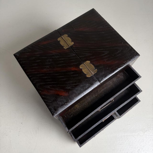 Compact Japanese writing box or small kodansu storage cabinet with a restrained, well-balanced form and a rich dark brown...