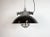 Industrial hanging lamp manufactured by Elektrosvit in former Czechoslovakia during the 1960s. It features a black enamel...