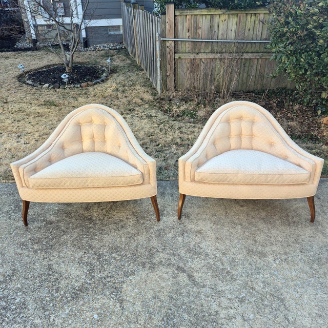 This is a really unusual pair of mid century modern low tufted three-legged triangle lounge chairs. The chairs are...