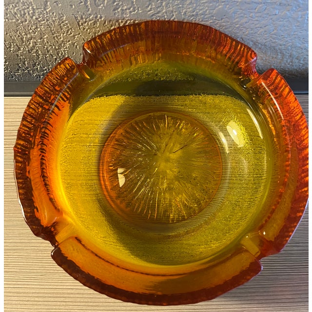 This stunning item is a 60's Mid-Century Modern heavy glass ashtray with a starburst pattern in the bottom. This vintage...