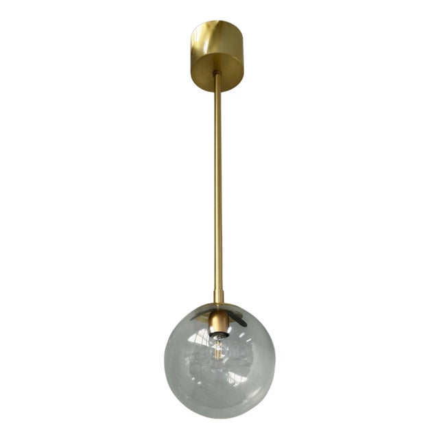 Uno Satin Brass Clear Globe Pendant by Fabio LTD For Sale