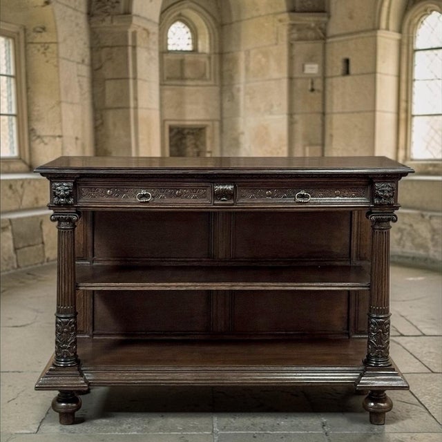 19th Century French Renaissance Revival Henry II Style Server is a distinguished piece executed in solid oak and retaining...