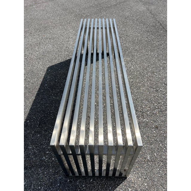 A stunning polished stainless steel bench. Classic design in the most unexpected material. Seamless construction in heavy...