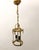 This darling two-light birdcage lantern features ornate detailing and a whimsical design. Three vertical posts are each...