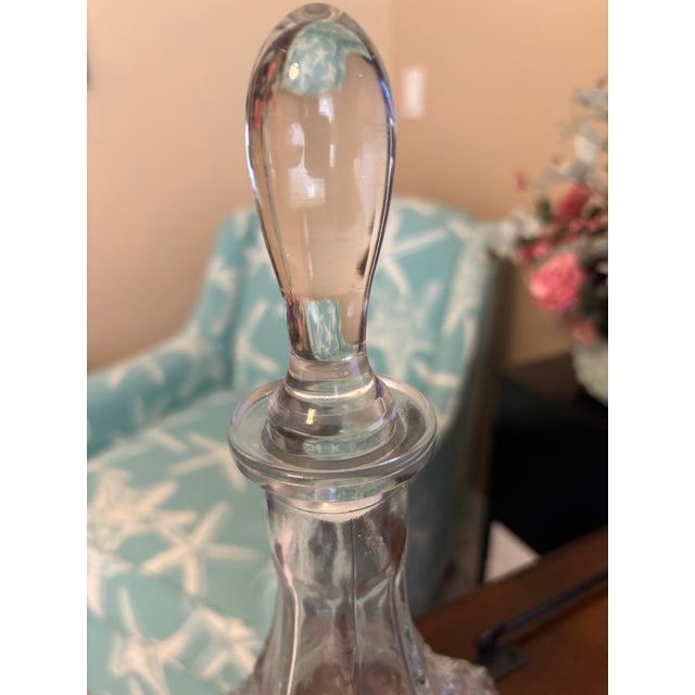 Elegant and richly detailed, this vintage clear glass decanter features a striking six-sided form with classic diamond-cut...