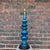 This is a large mid century ceramic table lamp that features a crackled blue and green glaze over a series of tiered discs...