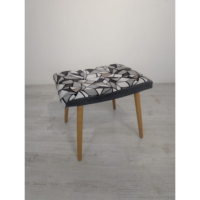 A stick pouffe, stool, or footstool from the communist era. A stylish pouffe, stool, or footstool from the communist era....