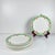 Set of 7 Sarreguemines "Maroussia" dessert plates, early 20th century White, green, orange and black Dimensions: Diameter:...