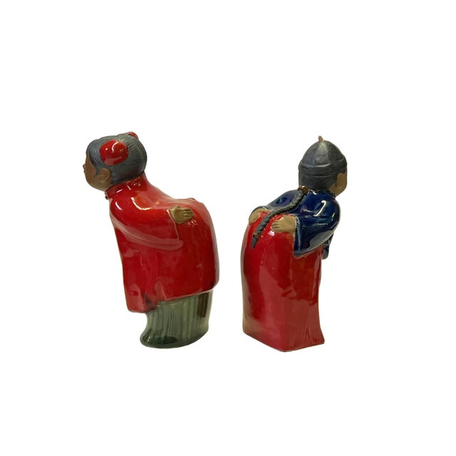 Charming Chinese Couple Figurines This delightful pair of Chinese decorative ceramic pottery figurines depicts a...