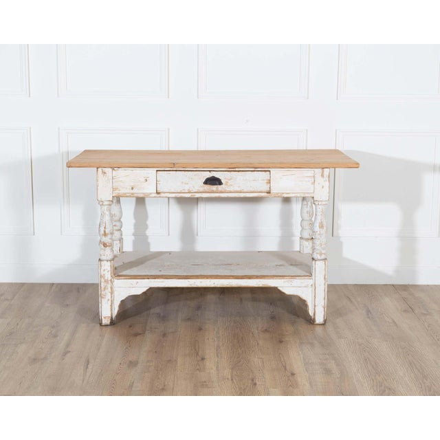 Charming 19th-century Swedish cutting table crafted in pine with its original painted surface, displaying a beautifully...