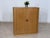 For sale is an elegant vintage wardrobe from the Danish manufacturer Nipu. This piece of furniture features two smooth-...