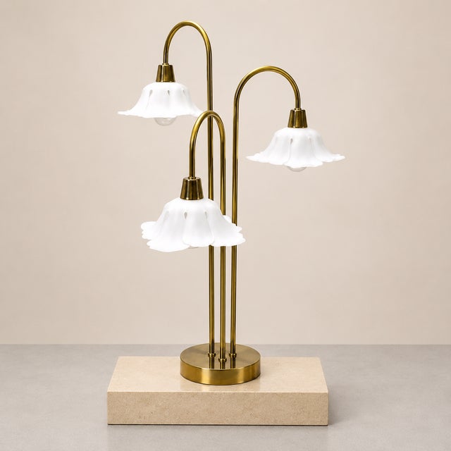 Vintage 1960s Hollywood Regency brass table lamp. This piece has 3 bulbs, all which are on bent brass, cascading waterfall...