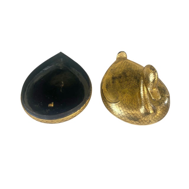 This charming Burmese trinket box showcases traditional lacquerware craftsmanship, featuring a duck form adorned with gold...