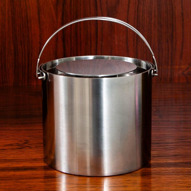 Vintage stainless steel ice bucket. Designed by Arne Jacobsen for Stelton. Original sticker beneath. Made in Denmark.