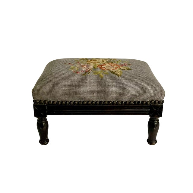 Charming vintage petite footstool featuring a beautiful floral needlepoint or petit-point upholstered top in light blue-...