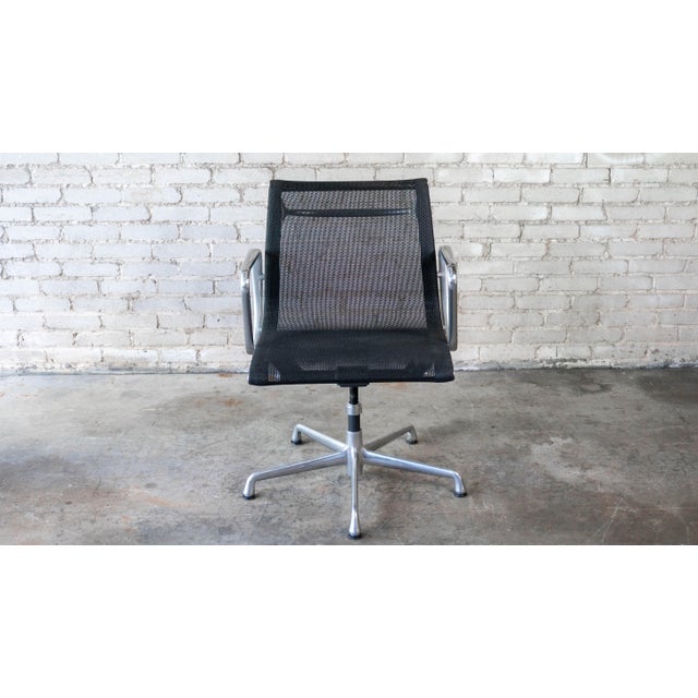 Herman Miller Aluminum Group Chair by Charles and Ray Eames, circa 2009. Iconic mid-century modern design, blends...