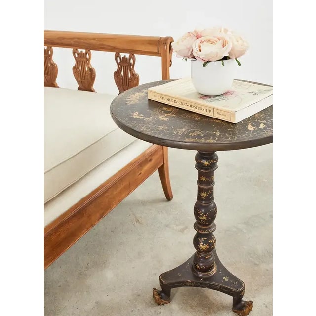19th century Engish tilt-top pedestal table made in the Chinoiserie revival period. The round table features a birdcage...