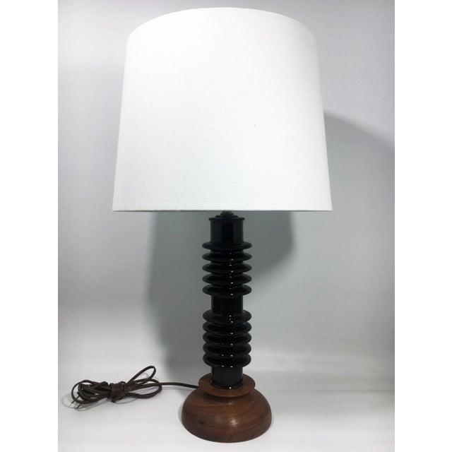 This unique stacked disk lamp features a solid walnut base and spool-like central column in brown ceramic salvaged from...
