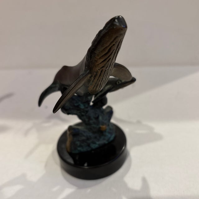 The SPI Gallery Humpback Whale & Calf Sculpture Figurine is a beautifully crafted bronze and brass sculpture measuring 7...