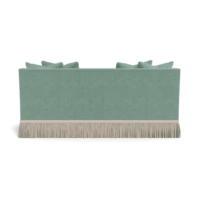 A deep, comfortable, and sophisticated sofa. Welcoming, curvaceous arms descend and slightly flare out, a sophisticated...